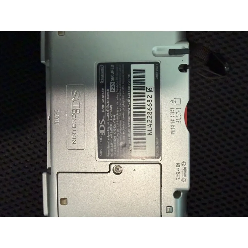Red nintendo DS with charger and 3 games gently used